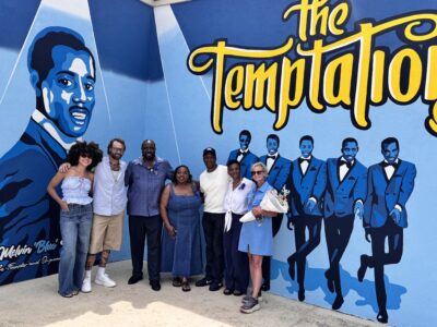 ILA Local 1410 President Mark Bass with family members of The Temptations Melvin Franklin in front of a new mural dedicated top him.